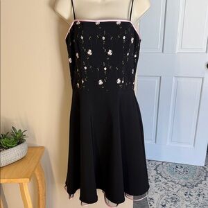 Taboo black dress with pink trim and embroidered flowers and vines